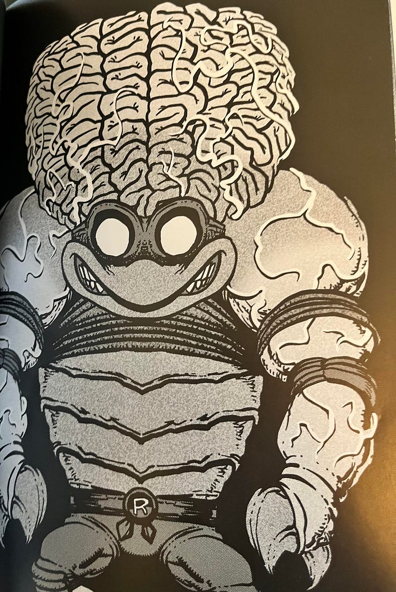 Ninja Turtle Raphael with a giant brain growing out of his cranium. He also has crab claws.